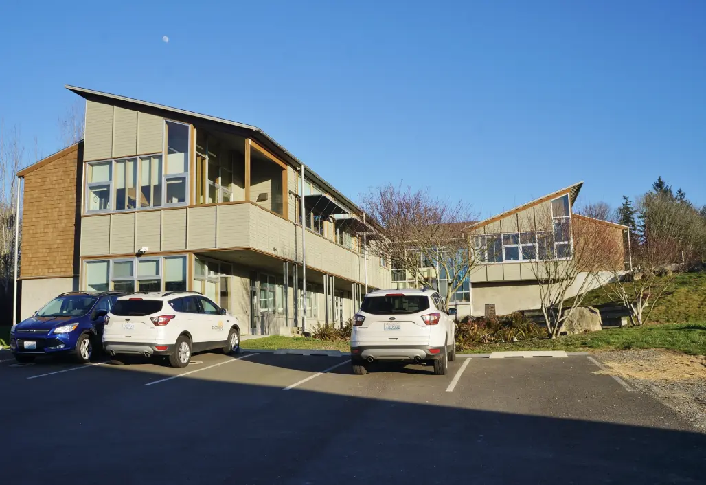 Suburb of edgwood wahsington with a parking lot and homes and trees