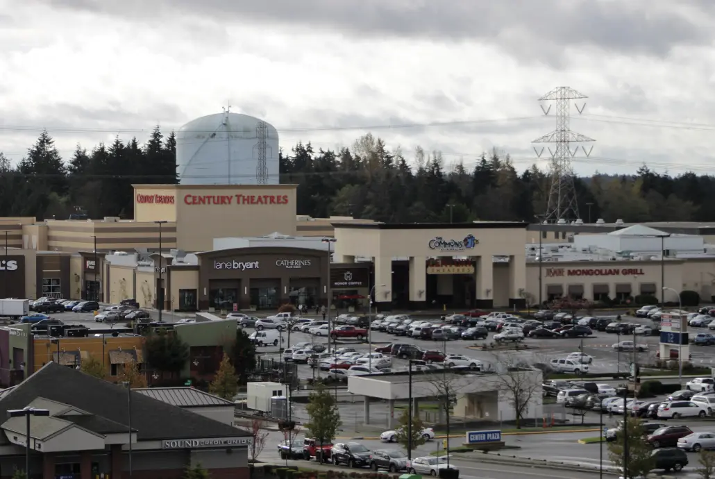 A shopping mart in Federal Way witha. filled parking lot