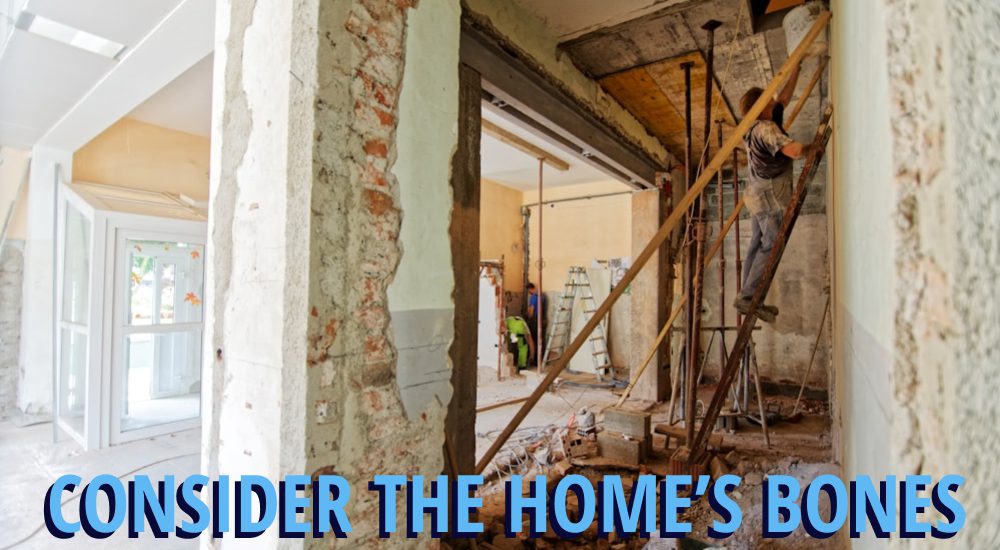 Home in the middle of a remodel with a wall opened up, caption reading 'consider the homes bones'